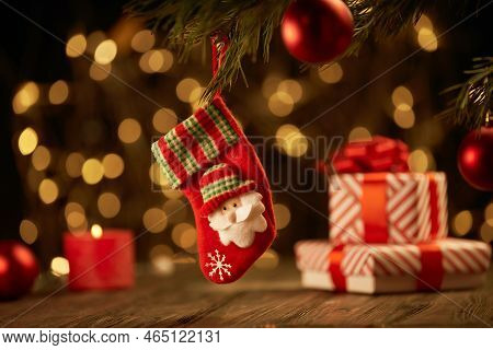 Christmas Stocking On A Blurry Festive Background.
