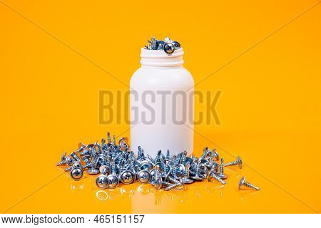 Many Metal Self-tapping Screws Made Of Steel In A Glass, In Bucket Jar. Self-tapping Screw For Metal