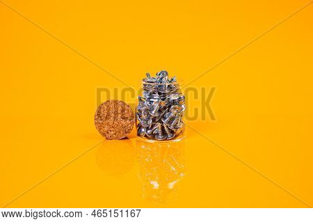 Many Metal Self-tapping Screws Made Of Steel In A Glass, In Bucket Jar. Self-tapping Screw For Metal