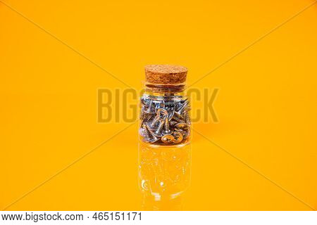 Many Metal Self-tapping Screws Made Of Steel In A Glass, In Bucket Jar. Self-tapping Screw For Metal