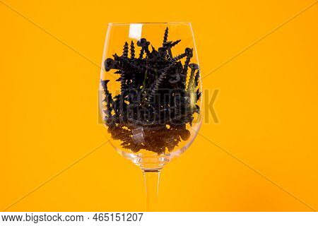 Many Metal Self-tapping Screws Made Of Steel In A Glass, In Bucket Jar. Self-tapping Screw For Metal