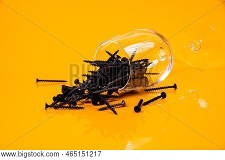 Many Metal Self-tapping Screws Made Of Steel In A Glass, In Bucket Jar. Self-tapping Screw For Metal
