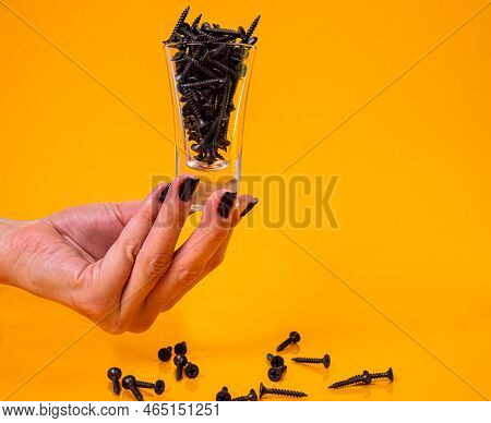 Dropped Many Metal Self-tapping Screws Made Of Steel In A Glass, In Bucket Jar. Self-tapping Screw F