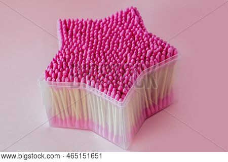 Pink Cotton Buds In Open Plastic Transparent Container Close-up