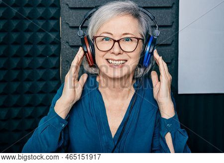 Hearing Loss Treatment. Positive Mature Woman Wearing Audiometry Headphones While Hearing Test And A