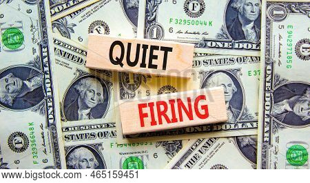 Quiet Firing Symbol. Concept Words Quiet Firing On Wooden Blocks. Beautiful Background From Dollar B