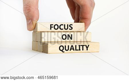 Focus On Quality Symbol. Concept Words Focus On Quality On Blocks On Beautiful White Table White Bac