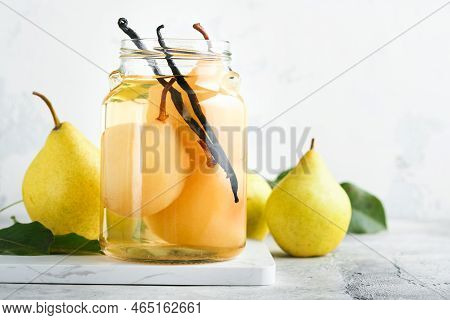 Canned Pear Compote With Vanillin. Pear Compote. Homemade Delicious Canned Pear Compote In Glass Jar