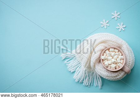 Hot Chocolate With Marshmallows In The Mug And Knitting Scarf. Fflat Lay Image On Blue.