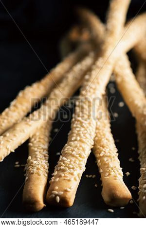 Grissini With Sesame Seeds, Also Known As Breadsticks, Grissino, Or Dipping Sticks, Are Generally Pe