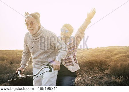 Happiness For Active Senior Retired People Lifestyle Concept - Joy Old Aged Caucasian Couple Riding 