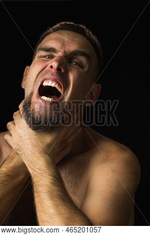 Portrait Of Young Man With Beard, Hands Around Throat, Screaming. Person Holding On To Sore Neck And