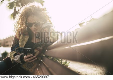 Autumn Season Colors With Beautiful Adult Attractive Blonde Curly Woman Use Mobile Phone Sitting On 