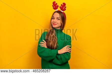 Happy Smiling Girl Standing With Crossed Hands, Wearing Green Knitted Sweater With Red Christmas Rei