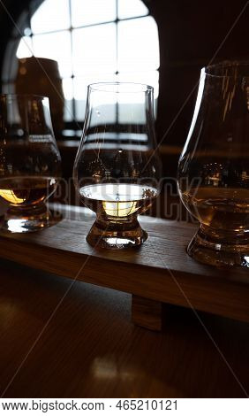 Flight Of Single Malt Scotch Whisky In Glasses Served In Whiskey Bar In Edinburgh, Uk