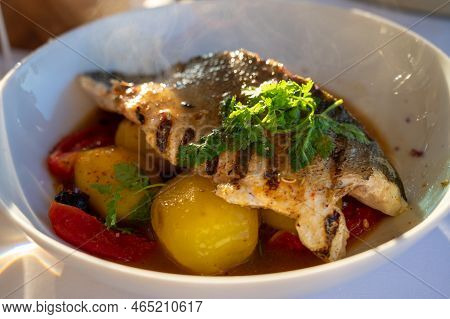 Provence Cuisine, Filet Of Seabass White Fish Served With Potatoes, Tomatoes And .bouillabaisse Jus
