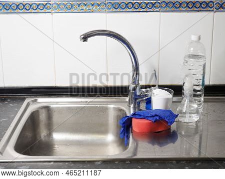 A Glass Jar Of Baking Soda, A Bottle Of White Vinegar On The Kitchen Sink. The Concept Of Cleaning W
