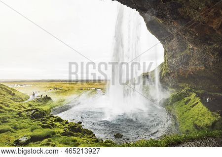 Looking At The Waterfall From Under The Rock - Iceland