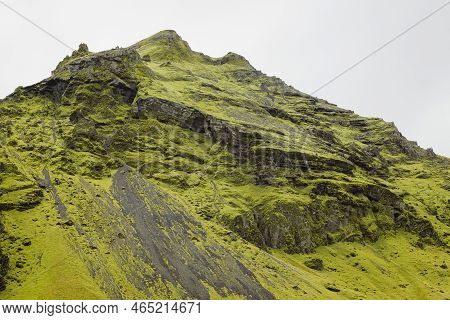 Slope Of Volcanic Mountains Near Skogafoss Waterfall