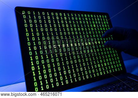 Ciber Security Concept. Gloved Hand, Binary Code And Cybersecurity Word On Laptop Computer Screen