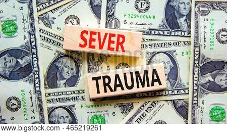 Sever Trauma Symbol. Concept Words Sever Trauma On Wooden Blocks. Beautiful Background From Dollar B
