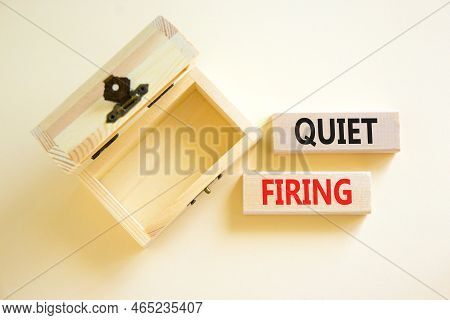 Quiet Firing Symbol. Concept Words Quiet Firing On Wooden Blocks. Beautiful White Table White Backgr