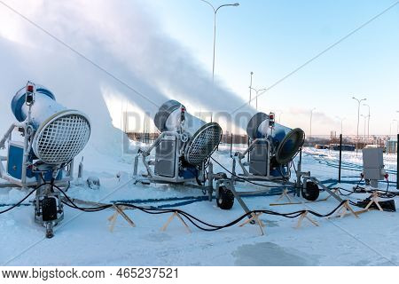 The Snow Cannons Sprays Artificial Snow Crystals. Cars Make Snow. Snow Guns. Artificial Snow System.