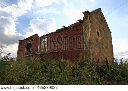 An Old House Falling Apart, Standing Somewhere In The Fields.