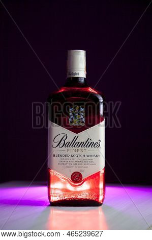 Ballantines Whiskey Bottle With Colorful Lights Background In Bar. Ballantines Concept. Whiskey Conc