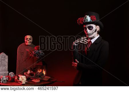 Santa Muerte With Suit And Hat Looking Mysterious Wearing Fstival Skull Make Up With Body Art, Celeb