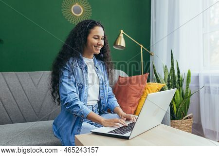 Happy Hispanic Woman At Home Working Remotely From Home, Customer Service Online Store Tech Support 