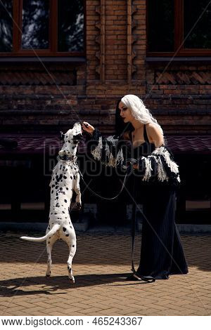 Cosplay On Cruella De Vil With A Dalmatian