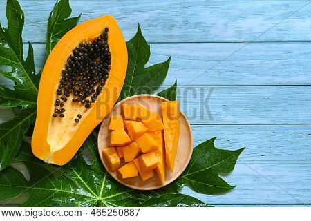 Papaya Fruits On Blue Backgroud, Fresh Ripe Papaya Slice Cut In Half Tropical Fruit With Papaya Seed