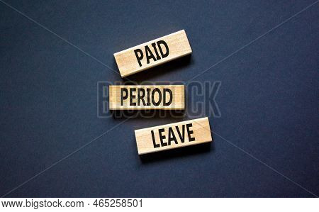 Paid Period Leave Symbol. Concept Words Paid Period Leave On Wooden Blocks. Beautiful Black Table Bl