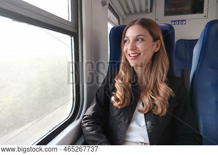 Portrait Of Young Satisfied Woman Traveling With Public Transport Sitting Relaxed Thoughtless