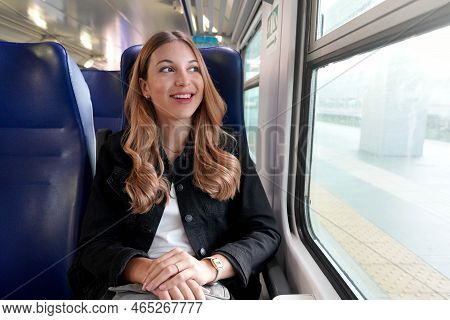 Portrait Of Young Satisfied Woman Traveling With Public Transport Sitting Relaxed Thoughtless