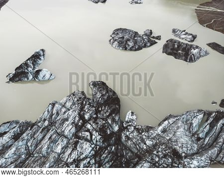 Melting Glacier In Iceland, Top Down View Of Icebergs In A Lake