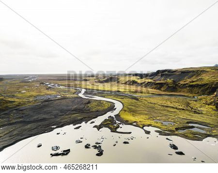 Aerial View Of River Flowing Trough Iceland Volcanic Landscape