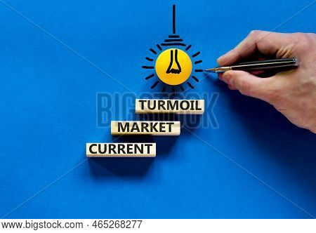 Current Market Turmoil Symbol. Concept Words Current Market Turmoil On Wooden Blocks On A Beautiful 