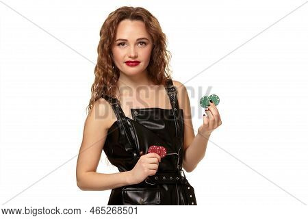 Casino Concept. Portrait Of Young Pretty Caucasian Woman, Playing In Casino. Roulette, Poker Chips, 