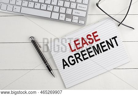 Text Lease Agreement On Keyboard On White Background