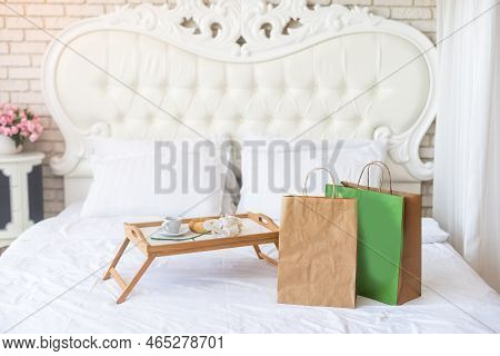 Delivery Food Craft Bag With Cup On The Bed On Sunny Day. Delivery In Any Weather Around The Clock T