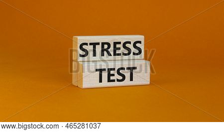 Stress Test Symbol. Concept Words Stress Test On Wooden Blocks On A Beautiful Orange Background. Bus