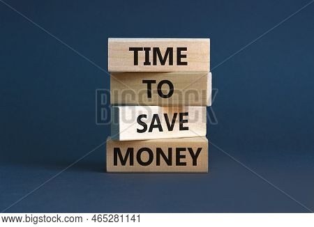 Time To Save Money Symbol. Concept Words Time To Save Money On Wooden Blocks On A Beautiful Grey Tab