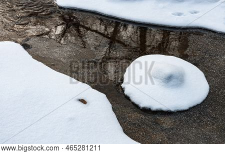 A Snow Muffin (snow Covered Rock) Sits In The Waters Of Willoway Brook, Dupage County, Illinois