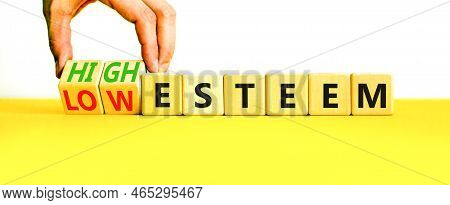High Or Low Esteem Symbol. Concept Words High Esteem And Low Esteem On Wooden Cubes. Businessman Han
