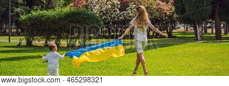 Banner, Long Format The War In Ukraine Is Over. Ukrainian Mother With Two Children With Flag Of Ukra