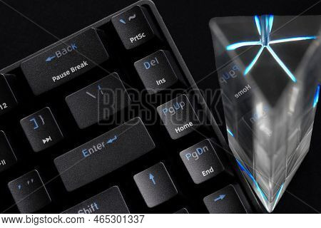 Fragment Of A Trendy Esports Computer Keyboard And A Glass Prism On A Dark Background. Copyspace. Ma