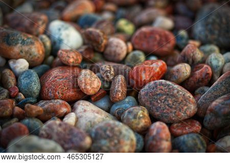 Horizontal Image Of Smooth Wet Red, White, Pink, Gray And Brown Pebbles Lying On A Lake Superior Bea