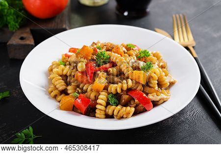 Vegetable Pasta Fusilli Corti Bucati With Eggplant, Sweet Pepper And Chicken In White Plate On Dark 